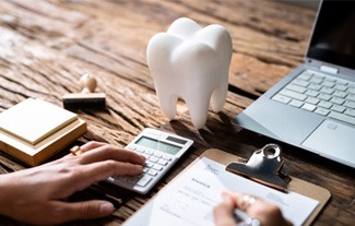 A patient calculating their dental insurance benefits