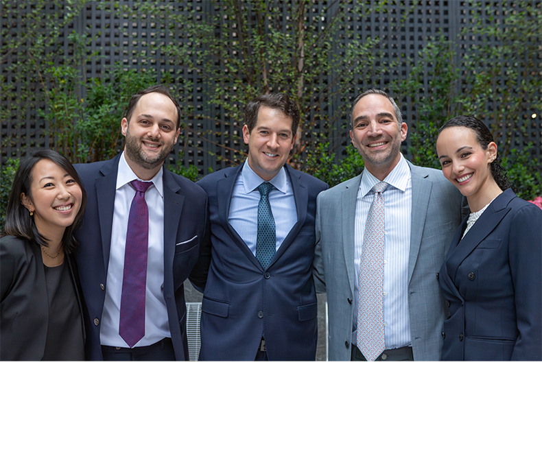 Five smiling New York City endodontists at J C Endodontics Root Canal Specialists